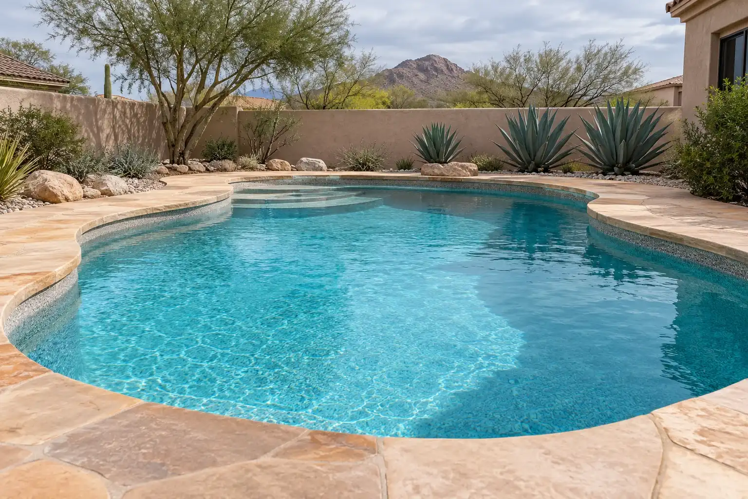 Freeform pool with a fresh finish and clean turquoise water
